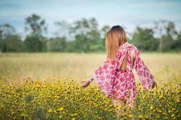 Beautiful girl in the flower field