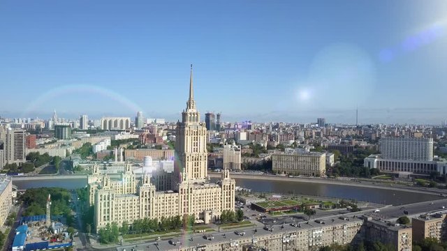 Aerial view of hotel Ukraine in Moscow. Old Soviet Russia Stalin high-rise skyscrapers in heart of modern Moscow City. Kutuzov avenue day traffic. Government building