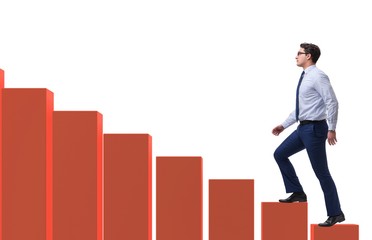 Businessman going up the bar chart in growth concept