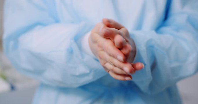 Doctor Disinfecting Hands with bactericidal gel
