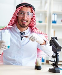 Arab chemist working in the lab office