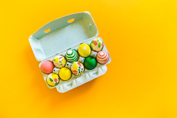 Painted Easter eggs in a box. Watercolor paint.