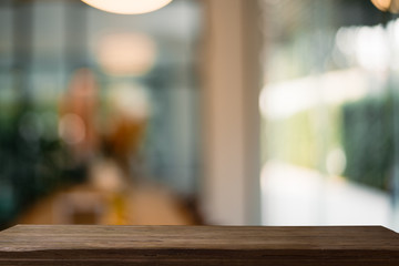 Empty wooden table with natural background.