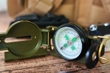 A compass and a backpack for a hike