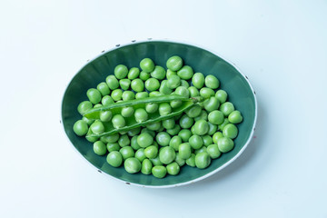Fresh Green Peas and pods on wood table
