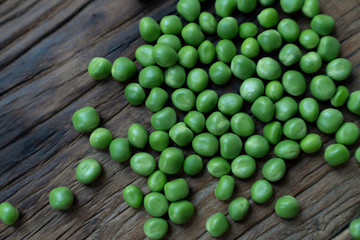 Fresh Green Peas and pods on wood table
