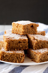 Homemade Delicious Applesauce Cake on a white plate, side view. Close-up.
