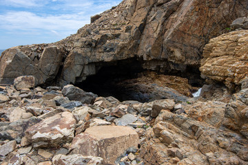 Cave rock formations leading to a secret coast with unique structure