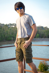 Asia man in bermuda shorts and t-shirt, outdoor activity concept