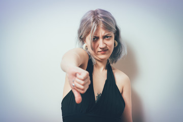 Woman showing a thumb down gesture
