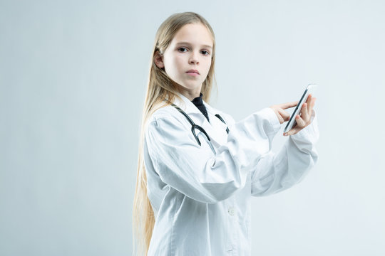 Serious Young Girl Dressed Up As A Doctor