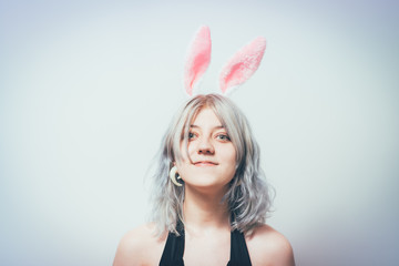 Portrait of girl with white rabbit ears - 335471442