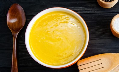Carrot soup served on the table in bowl