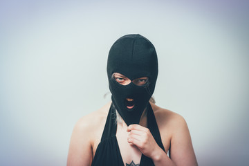 woman wearing balaclava or mask on head - 335471852
