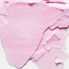 Pink cosmetic cream smear on white background. Beauty creme swipe. Skincare product creamy texture. Color corrector smudge swatch. Skin care. Mask for the face or body