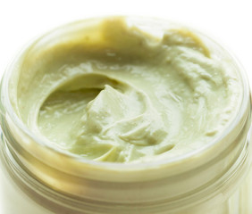 A natural ingredients body cream or mask in a jar on white background. Skin care, spa and clean cosmetic concept. Health and beauty. Close-up