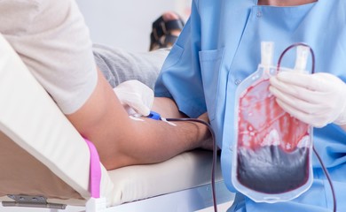 Patient getting blood transfusion in hospital clinic