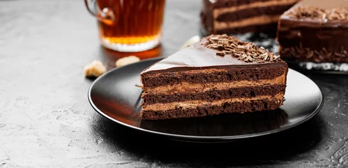 Kussenhoes Yummy layered chocolate cake on black stone background. © Nelea Reazanteva