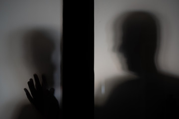 silhouette of a person reaching out and comforting another person