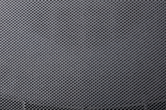 Fine mesh plastic grid with texture and background.