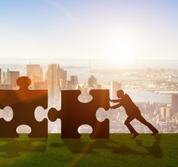 Business metaphor of teamwork with jigsaw puzzle