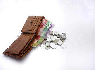 wallet and money on a white background