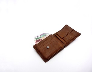 wallet and money on a white background