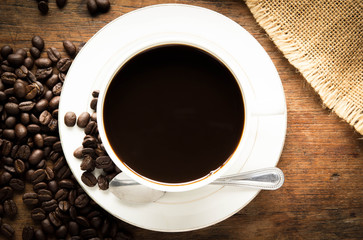 cup of hot coffee with beans