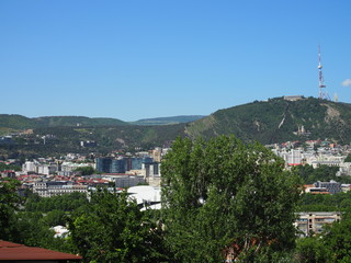 Fototapeta na wymiar Tbilisi cityscape with Mtatsminda mountain at background, Georgia
