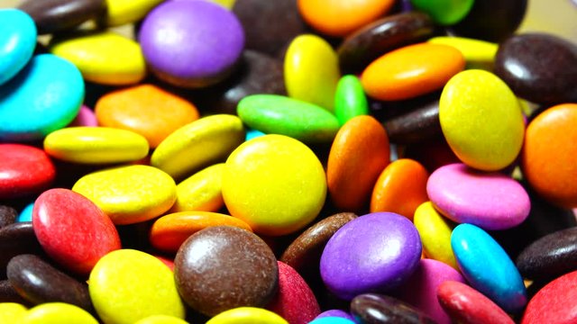 4K Multicolored, sweet chocolate candy on background