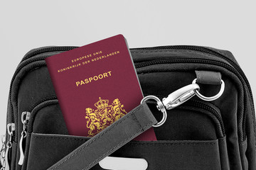 Close up of Netherlands Passport in Black Travel Bag Pocket