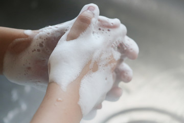 Washing hands with foam cleaning for personal hygiene protection from bacteria and influenza virus