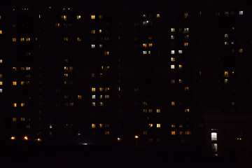 Fototapeta na wymiar night city lights. light in the windows of houses
