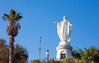 Santiago, Chile, Statue of the virgin Mary on the hill of San Cristobal.
 The snow-white statue of the Holy virgin Mary, considered the patroness of the townspeople, stands on the very top of the rock