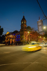 Melbourne architecture at night with city traffic