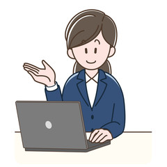 パソコンの前で案内するスーツの女性