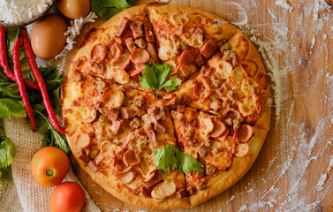 Pizza on rustic grey background, top view. Pizza with minched meat, celery and Mozzarella Cheese close up.