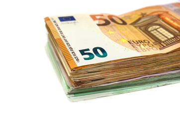 stack of euro banknotes on a white background.