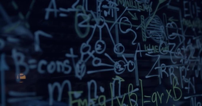 scientist at work writes the formula on the glass