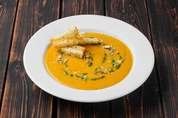 Aubergine soup puree with pumpkin seed and crouton