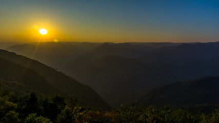 Sunset in the mountain valleys during the golden hour