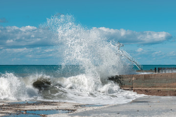Big sea wave crashing on the pier/ Black Sea Coast/ Sochi