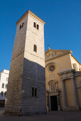 Fototapeta na wymiar The Church of the Assumption of the Blessed Mary and the leaning tower in central Rijeka, in the Primorje-Gorski Kotar county of Croatia 