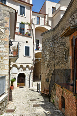 Guardia Sanframondi, Italy, 04/30/2018. A narrow street among the small houses of a medieval village in the Campania region