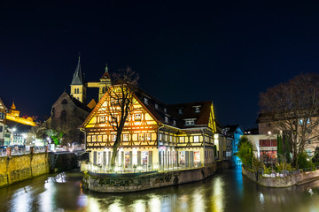 Naklejka premium Germany, Famous city district little venice in medieval city esslingen am neckar illuminated by night under magical starry sky full of stars