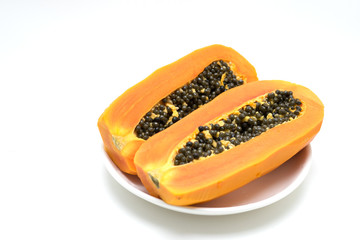 Papaya fruit peel in a plate on white background