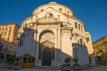 Fototapeta premium Saint Vitus Cathedral with a nativity scene outside it on CHristmas day. This historic Baroque rotunda is located in central Rijeka in the Primorje-Gorski Kotar county of Croatia 