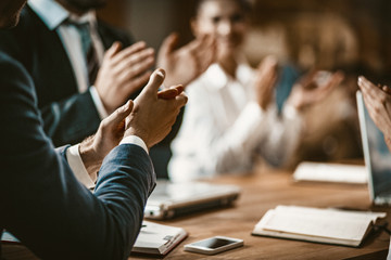 Business People Clapping During Meeting In Board Room - obrazy, fototapety, plakaty