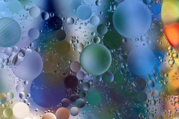 Colorful abstract background with oil circles/ Water bubbles close-up/ Oil bubbles in water/ Circle bubbles background