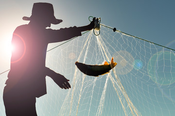 fishing man gathering nets every morning and making a living with fishing © emerald_media